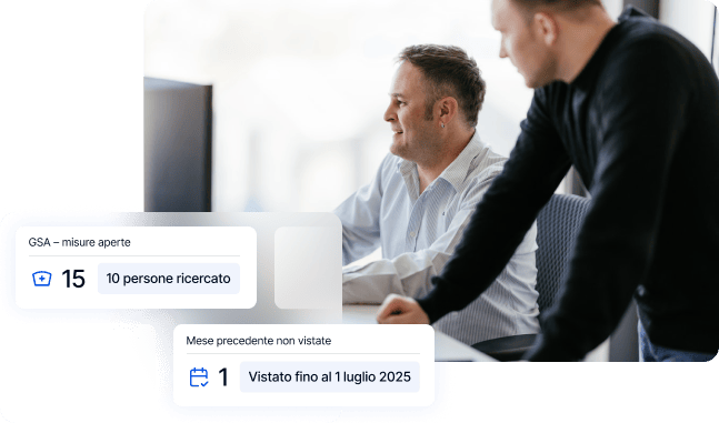 IT (two men at a desk with a computer)